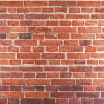 Detailed red brick wall background texture, copy space.